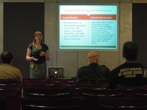 Librarian standing to the right of powerpoint display